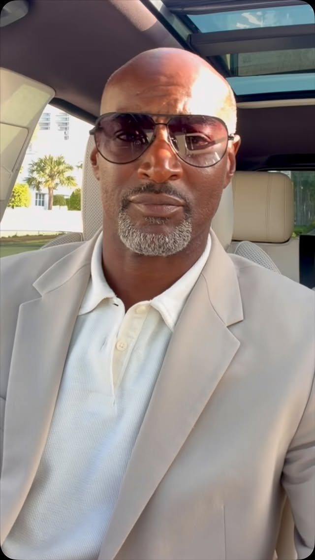 Frank Delour in a white suit